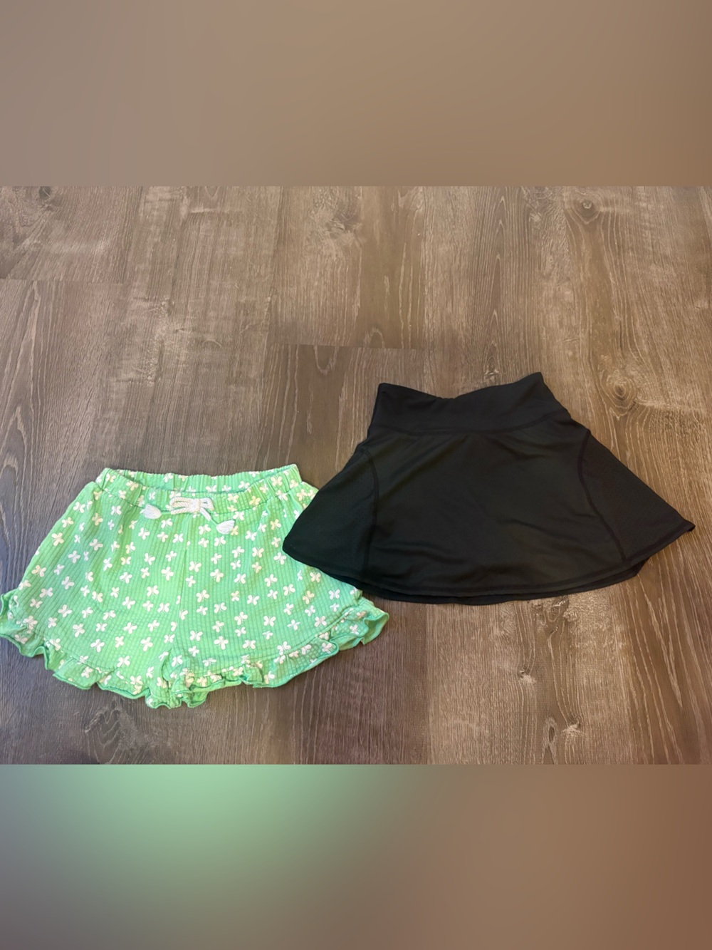 Girls size 7 bottoms (2)- Black Bottom & Green Floral shorts